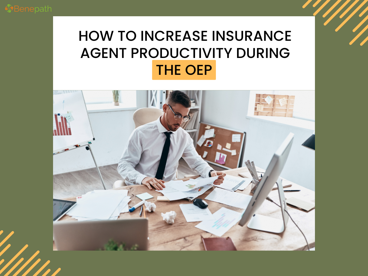 Insurance agent working at a cluttered desk with documents and charts, focused on increasing productivity during the Open Enrollment Period (OEP)